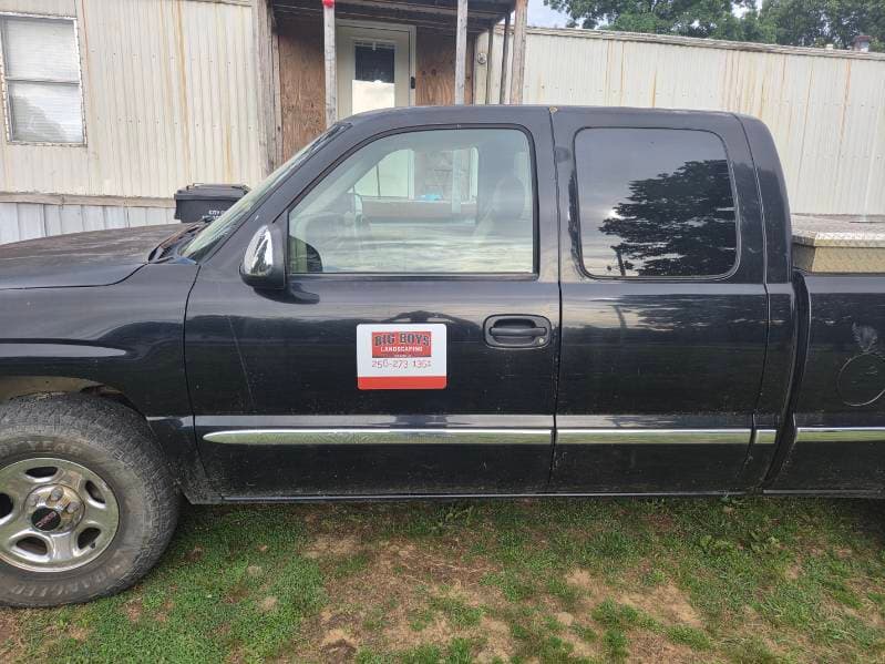 Black Big Boys Landscaping pickup truck with branded door magnet